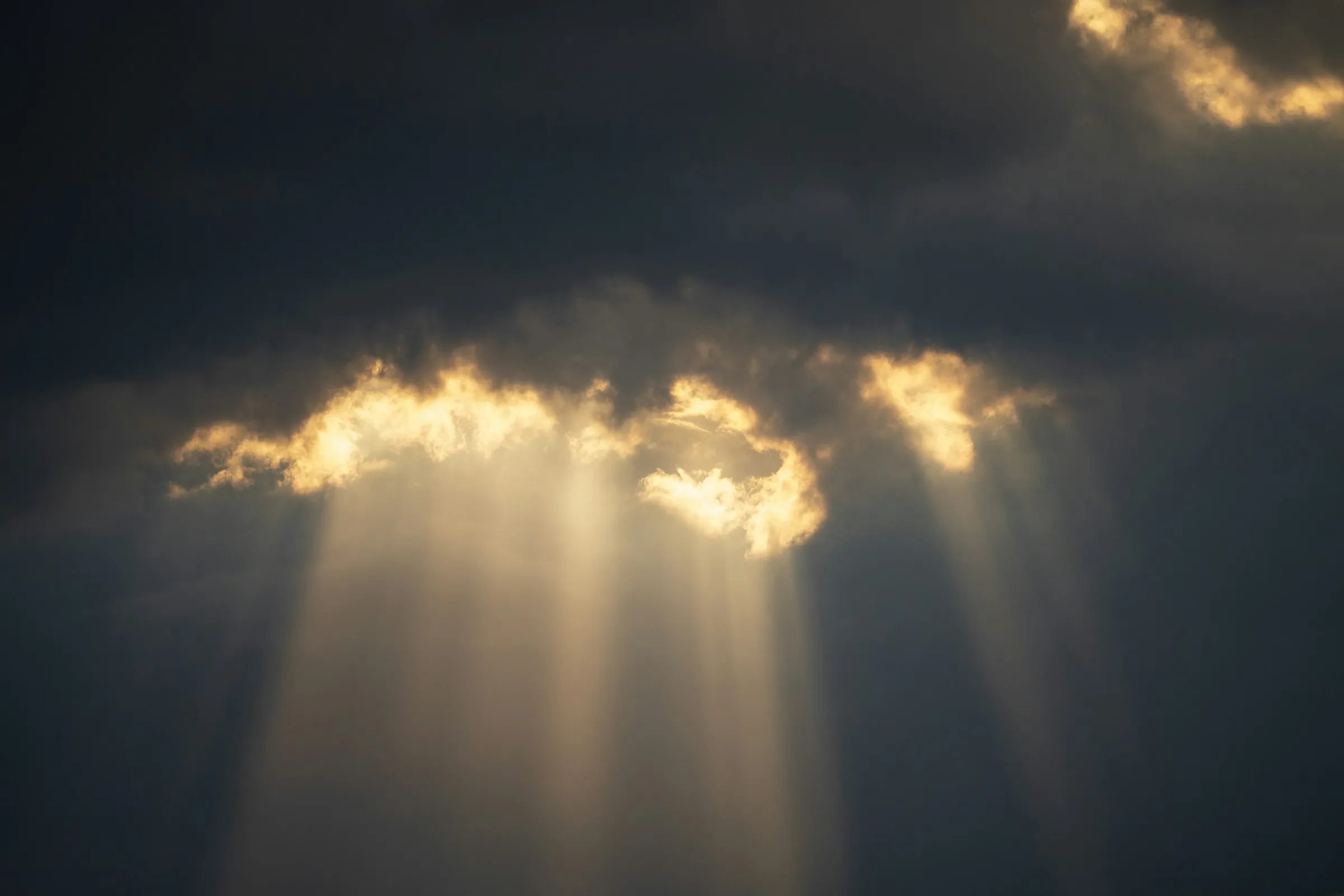 Sunlight breaking through a bank of clouds